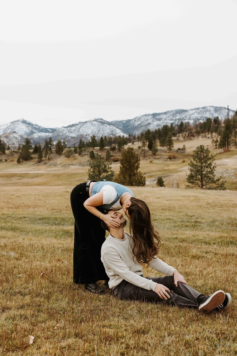 Adventurous couple hiking to a mountain overlook during their Lake Tahoe session