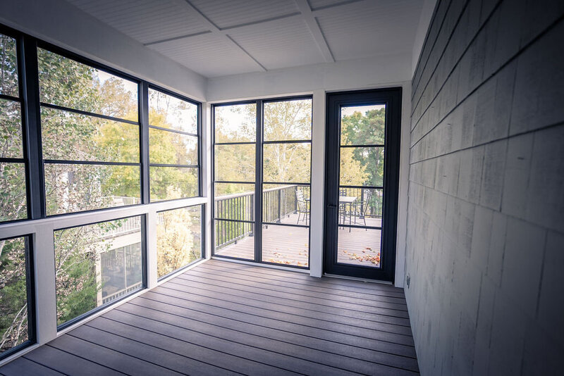 Inside a 3-season porch with vinyl 4-panel windows. 