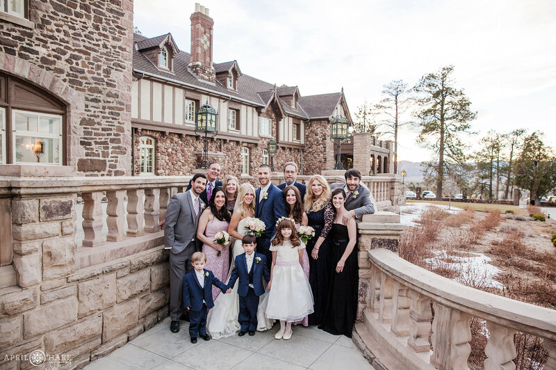 Family formal portraits during winter on the front Veranda of Highlands Ranch Mansion in Colorado