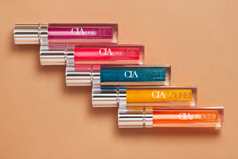 Cia Laura lipstick collection neatly arranged, showcasing a range of colorful shades, captured by Ylva Erevall.