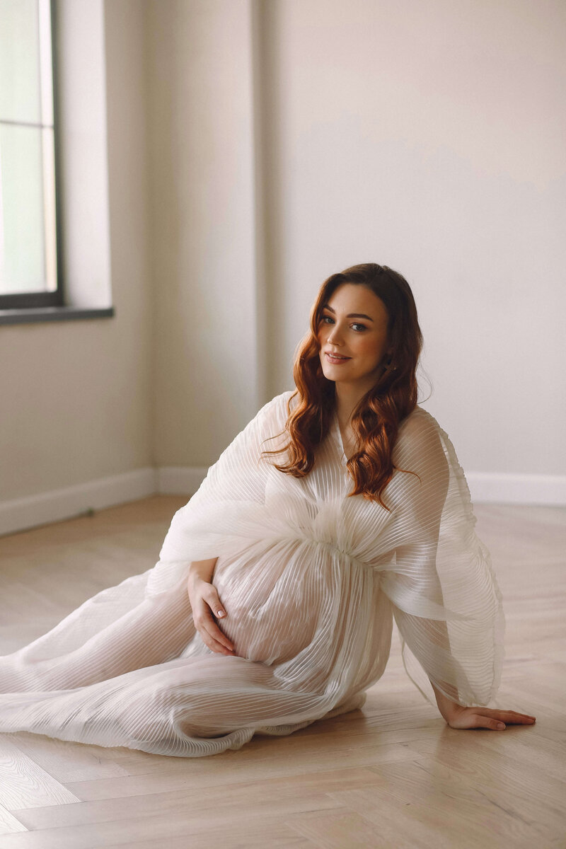 portrait-beautiful-pregnant-woman-stylish-white-dress-posing-studio-happy-motherhood (1)