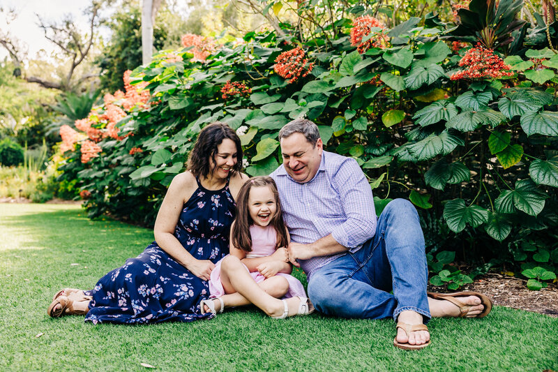 Parents with young children enjoying holiday mini sessions in Old Northeast St. Pete.