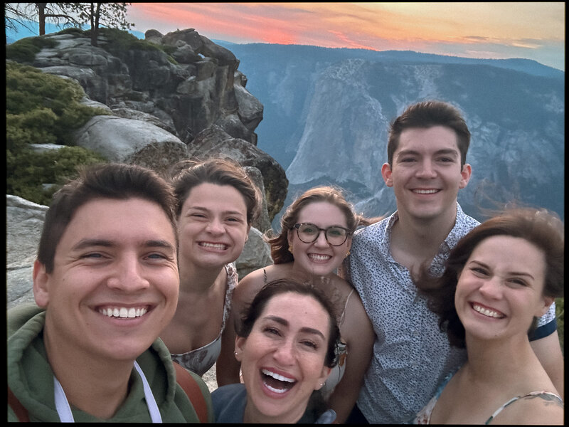 Photo with Haley and clients and friends on top of Yosemite while shooting their elopement photographs.