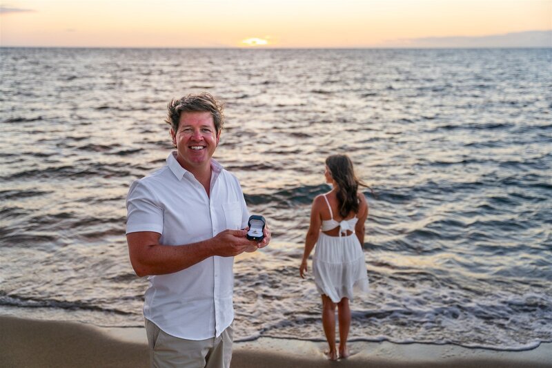 Woman reacting with joy after a surprise proposal on the beach in Waikoloa, photographed by Hawaii Adventure Portraits, a Big Island proposal photographer