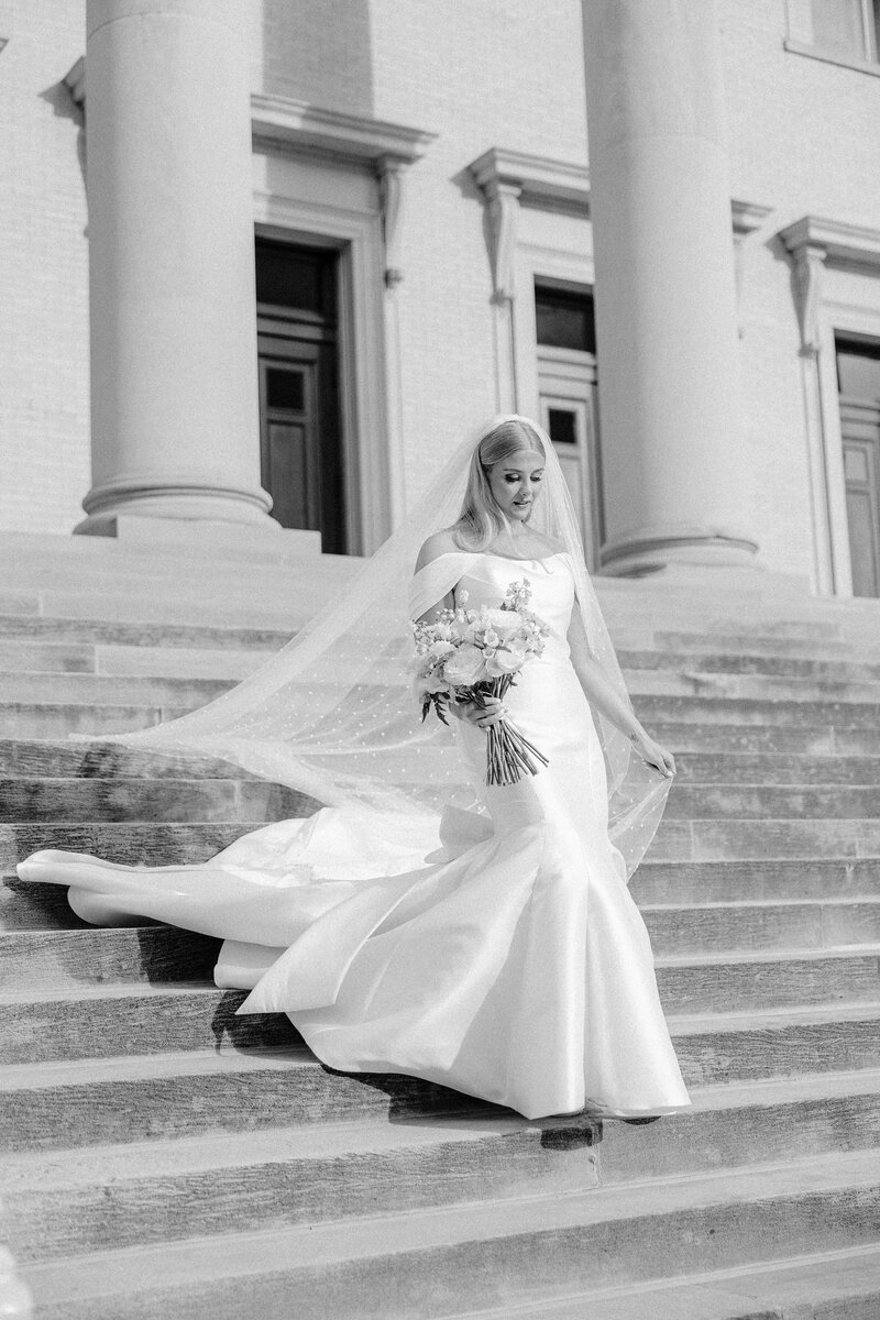 Bridal portrait on church steps edited to black & white
