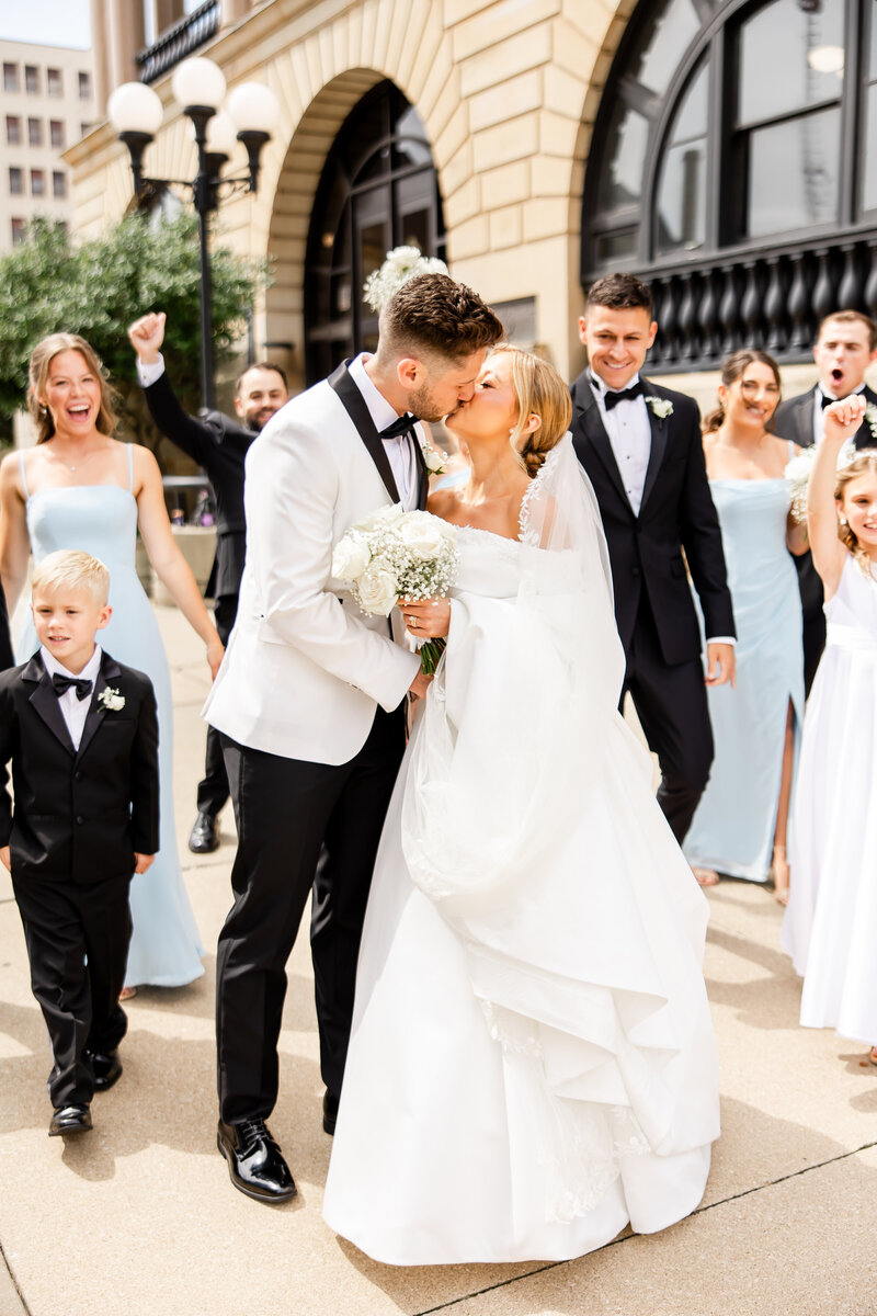 Bride and Groom kissing on wedding day at Encore Hall in Berlin Ohio