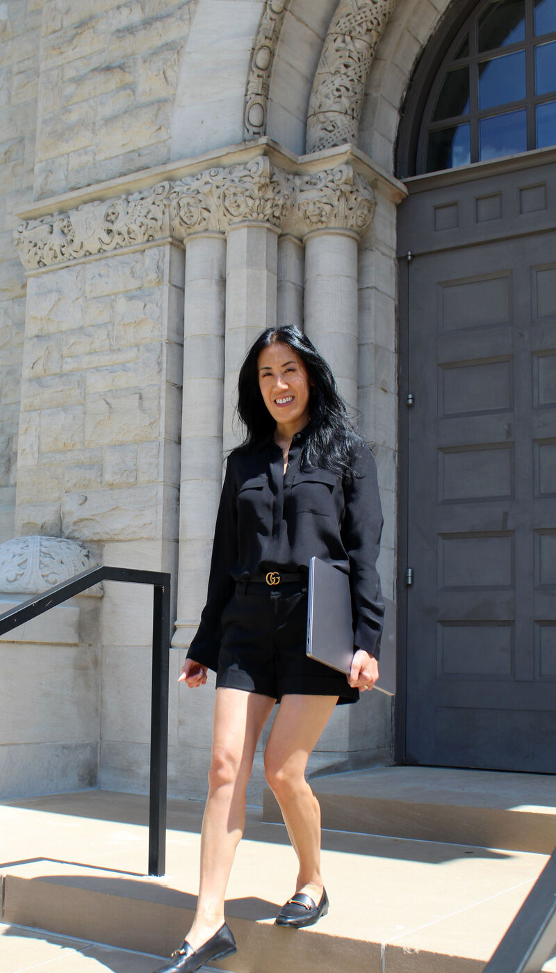 Woman on steps of old courthouse