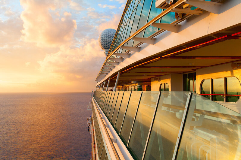 side view of cruise ship at sunset