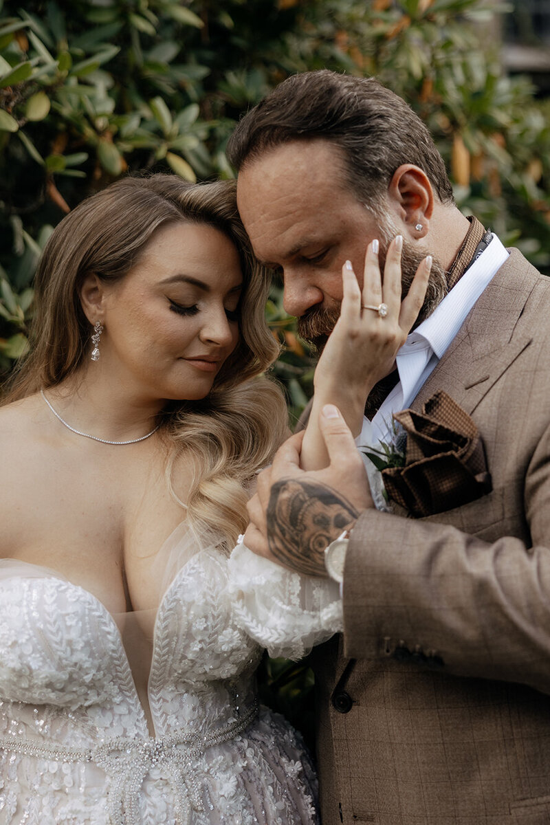 bride-adoring-groom-in-tan-suit-outside-keli-photography-new-england-weddings-hudson-valley-weddings