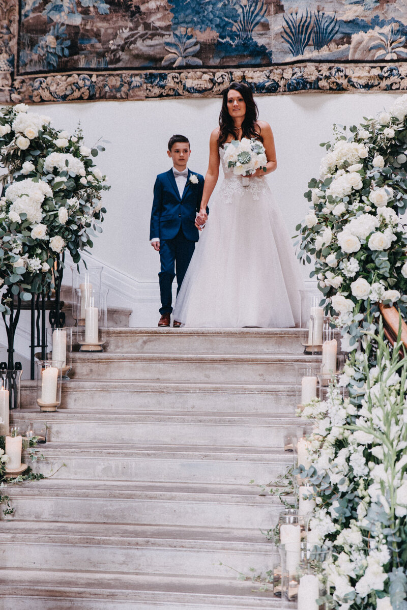 Bride walking down the stairs at Scorrier House