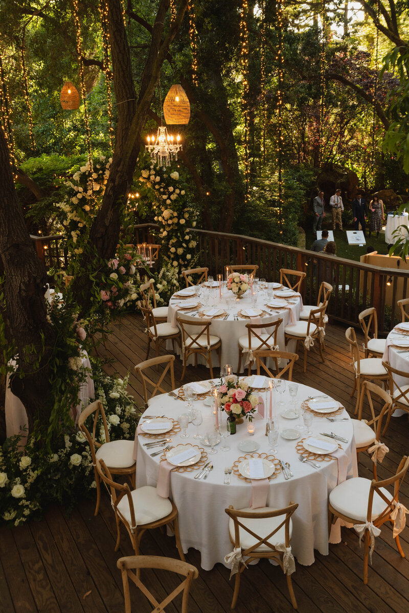 wedding reception tables on a deck 