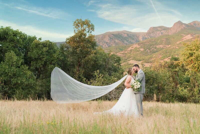 Bride and groom portraits with the mountains at Oak Hills Reception and Event Center