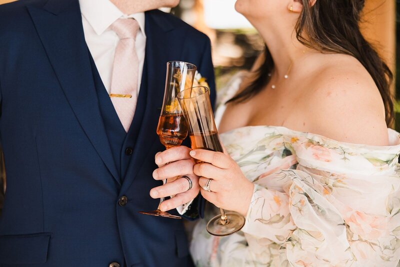 Couple clinking glasses filled with prosecco