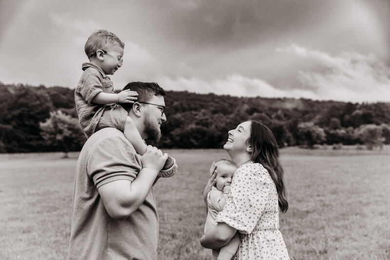 Couple posing in their home during an in home newborn photoshoot