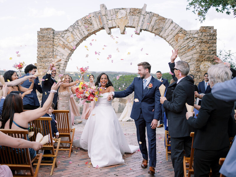 Bride and groom exiting ceremony at wedding planned by Bianca Nichole and Co