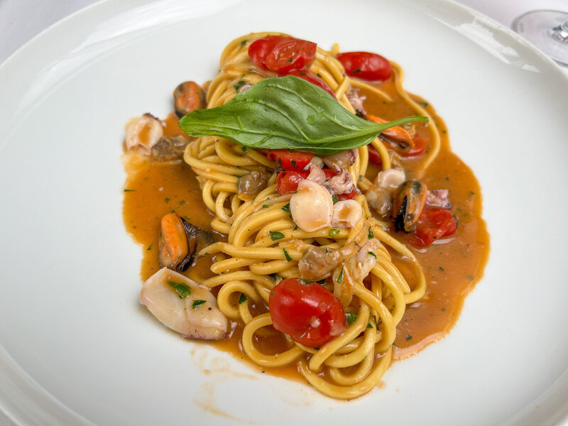 A wonderfully prepared plate of chitarra seafood pasta at Paper Moon Giardino in Milan, Italy