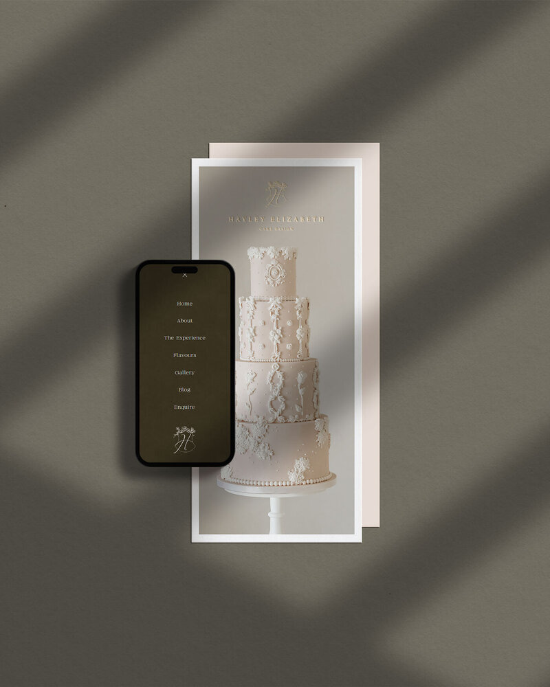 Mobile phone website mockup and branded notecard for Hayley Elizabeth Cake Design on a deep green background