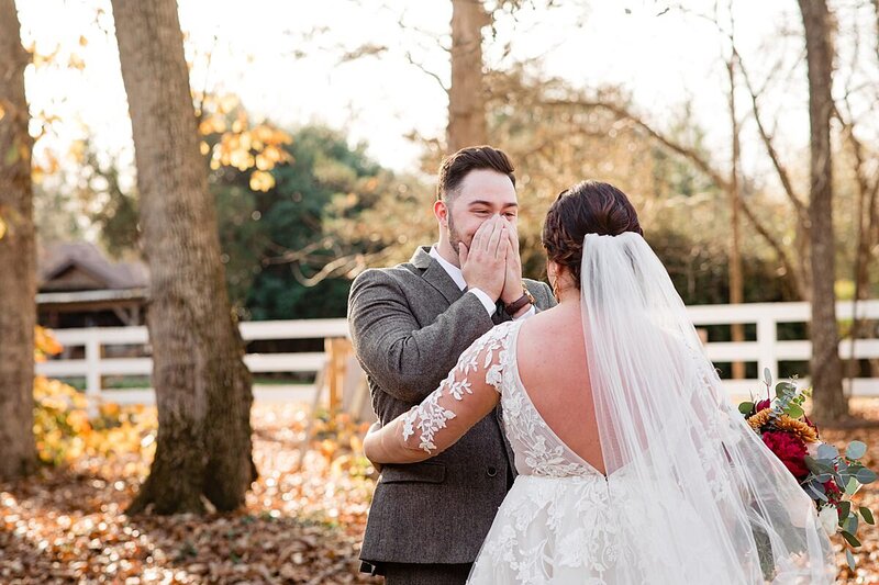 Groom wearing tweed suit and crying when he first sees his wife on their wedding day