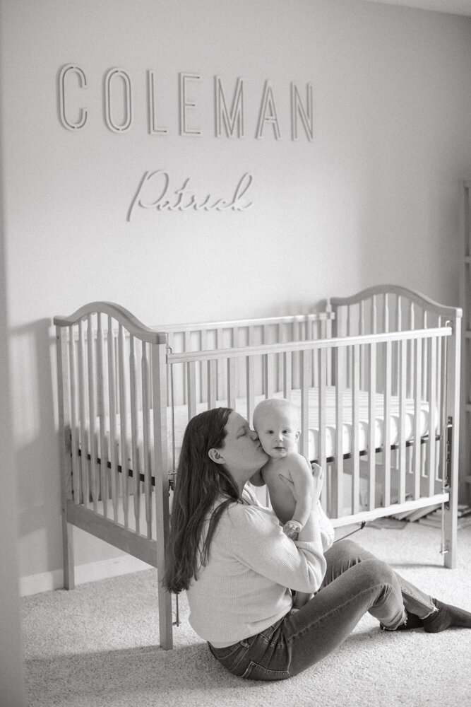 Mary holding Coleman in his nursery