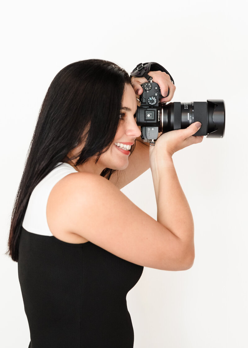 brand photographer camera on hand shooting