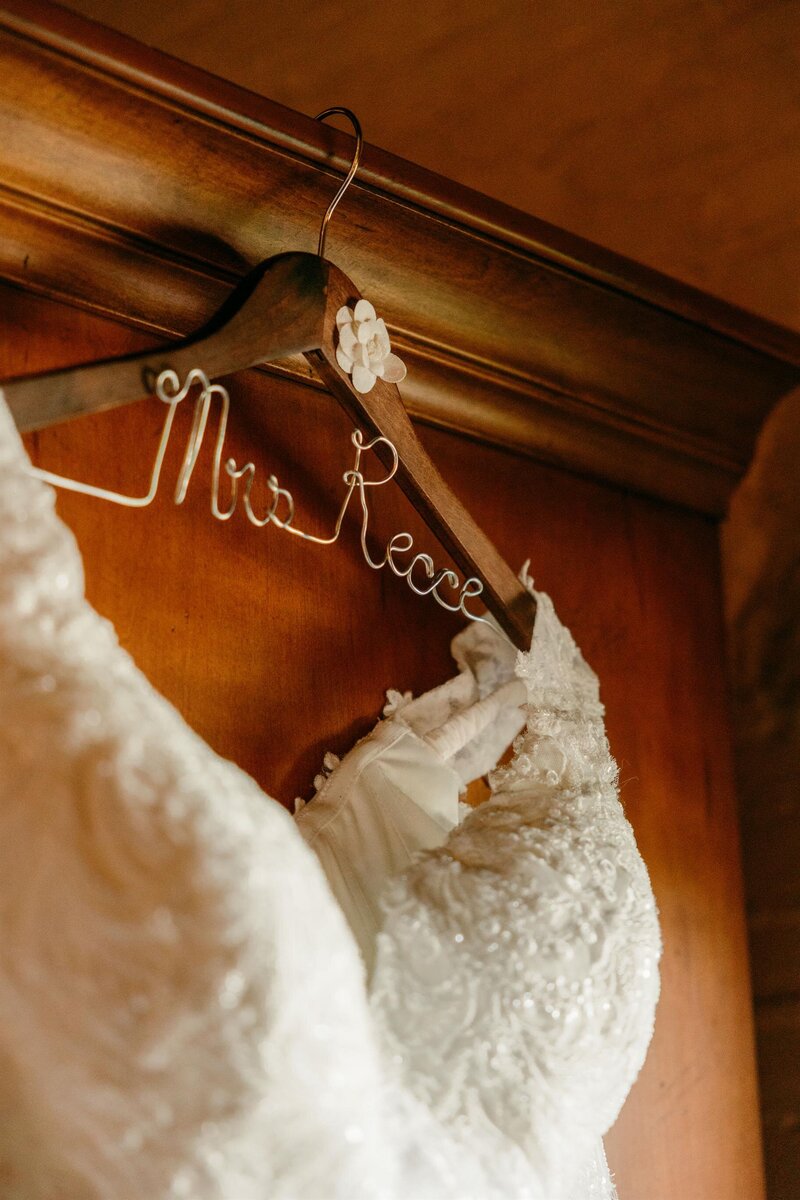 Customized wedding hanger detailing a custom last name.