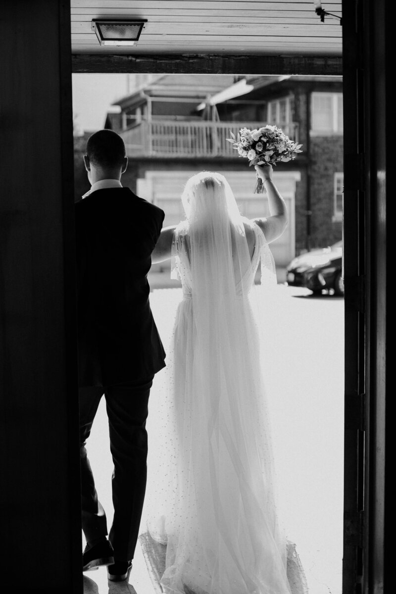 Bride and groom exiting ceremony cheering