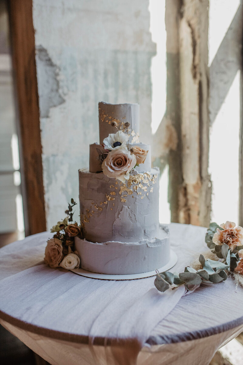 purple wedding cake with flowers