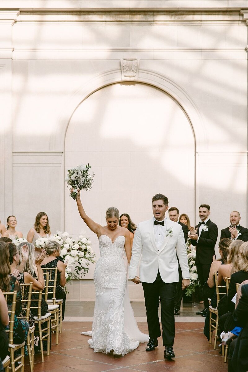 Garden Wedding with Chic Ceremony Seating & Greenery Backdrop