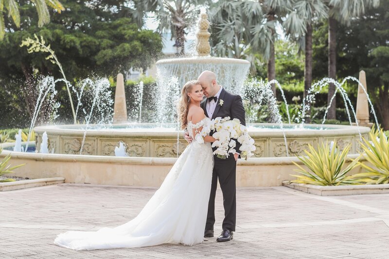 south-florida-bride-groom-fountain-behind