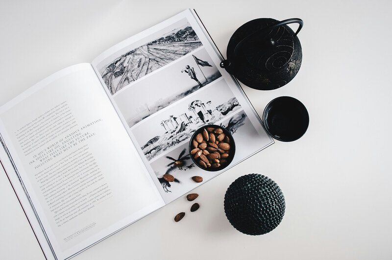 Black teapot and bowl of nuts with a book on a table, symbolizing financial clarity and the freedom to focus on what truly matters in life. Ataraxis Financial helps business owners eliminate financial stress, gain peace of mind, and embrace both business growth and life’s adventures.