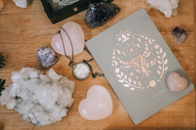 Crystals and book on a desk