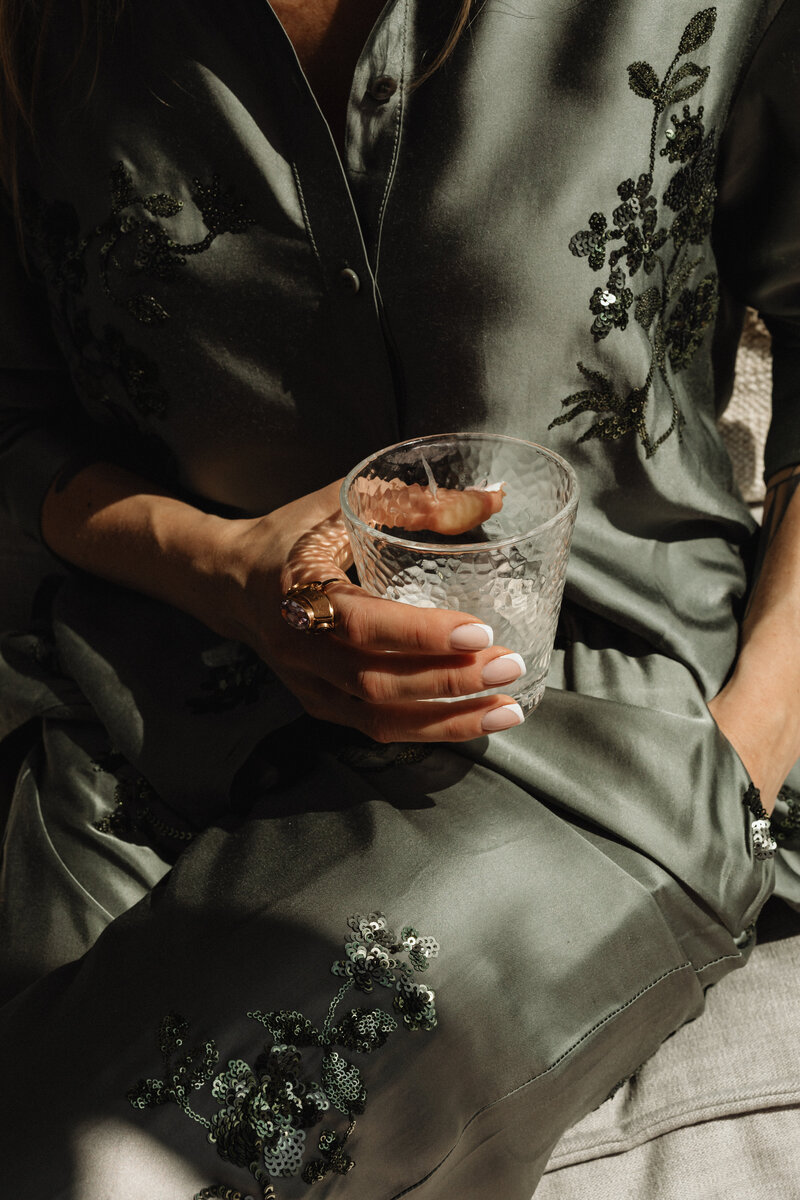 kaboompics_woman-in-satin-ensemble-with-french-manicure-holding-a-glass-of-water-32276 (1)