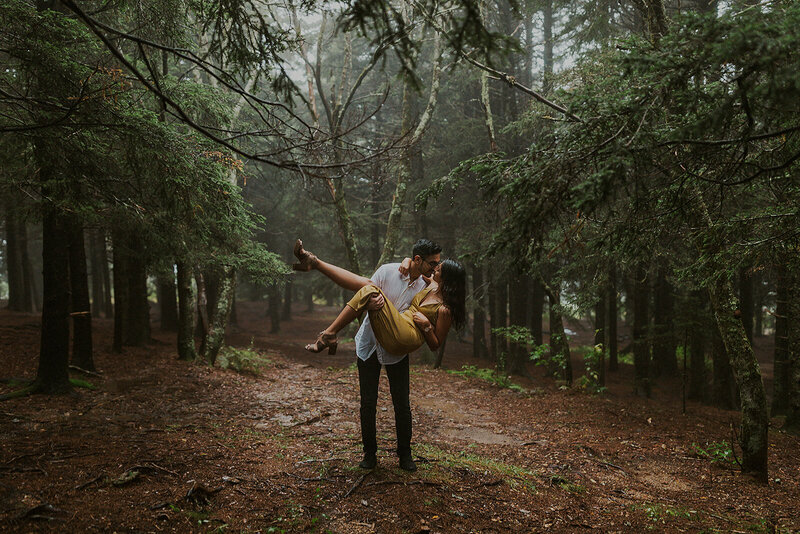couple holding each other in the forest