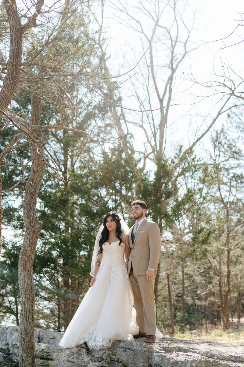 couple standing among the trees at destination elopement in tennessee