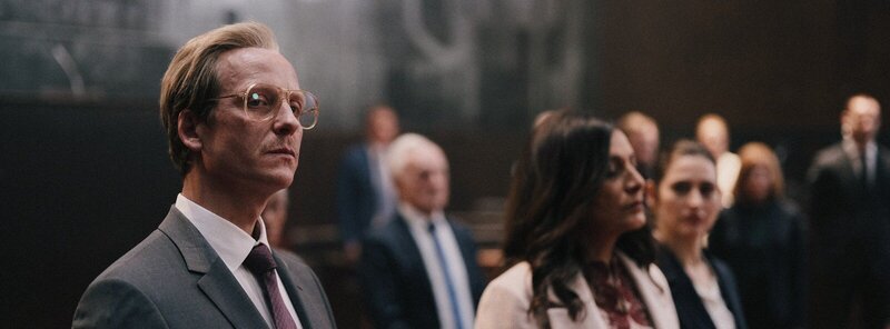 Film still from "Dangerous Truth – Das zweite Attentat," depicting an intense investigation scene.