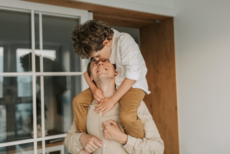 Son on father's shoulders