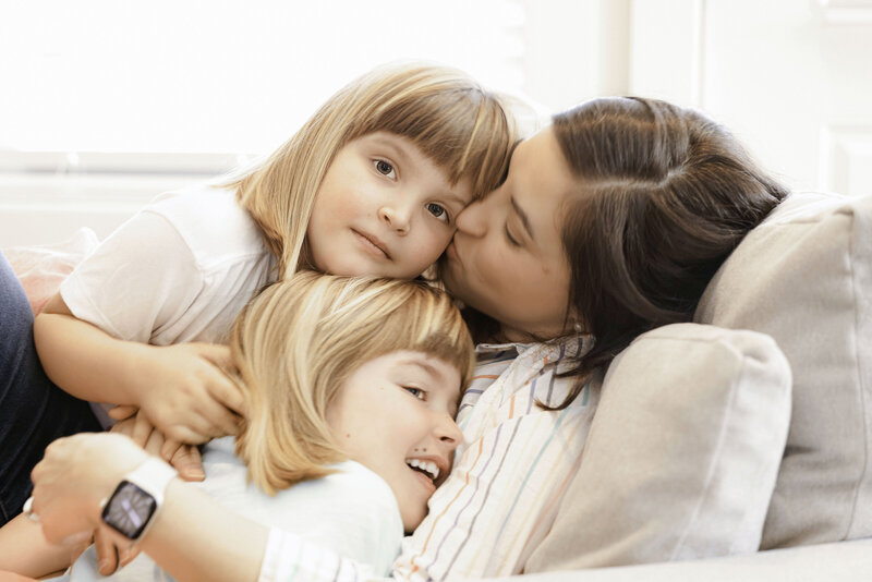 Mom with her two daughters, in-home lifestyle session