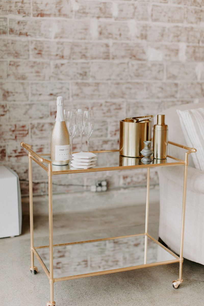 Gold mirrored cart bar with drink decor