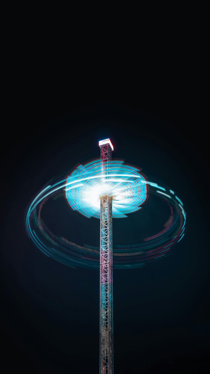 A long-exposure spinning tower light showing patterns emerging from motion, symbolizing diagnosing organizational chaos.