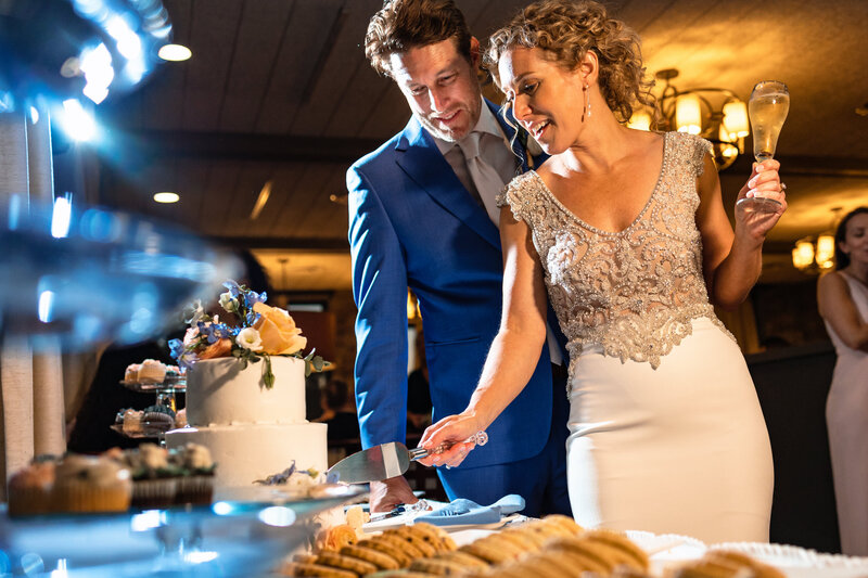 A wedding couple cuts the cake at the Sylvania Country Club in Ohio