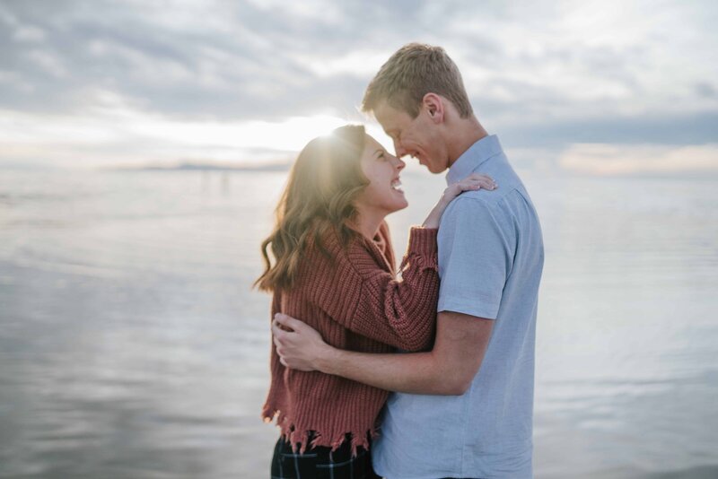 outer banks couple looking into each other's eyes and smiling