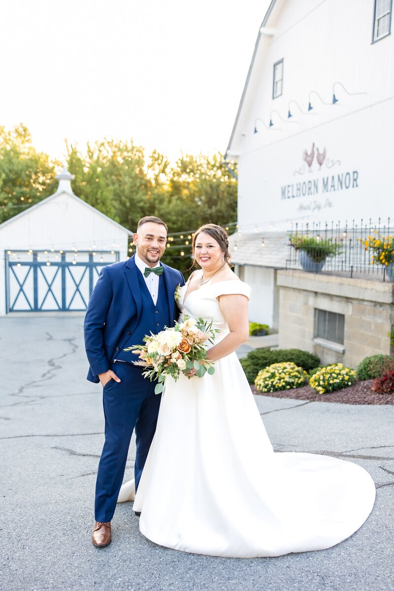 Bride and groom smiling at each other as they gaze into each others eyes