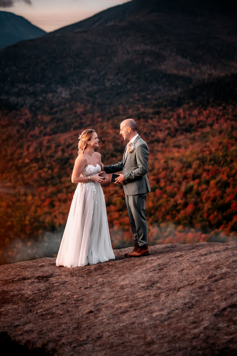 a couple treks through the woods after their elopement during the morning sunlight. 