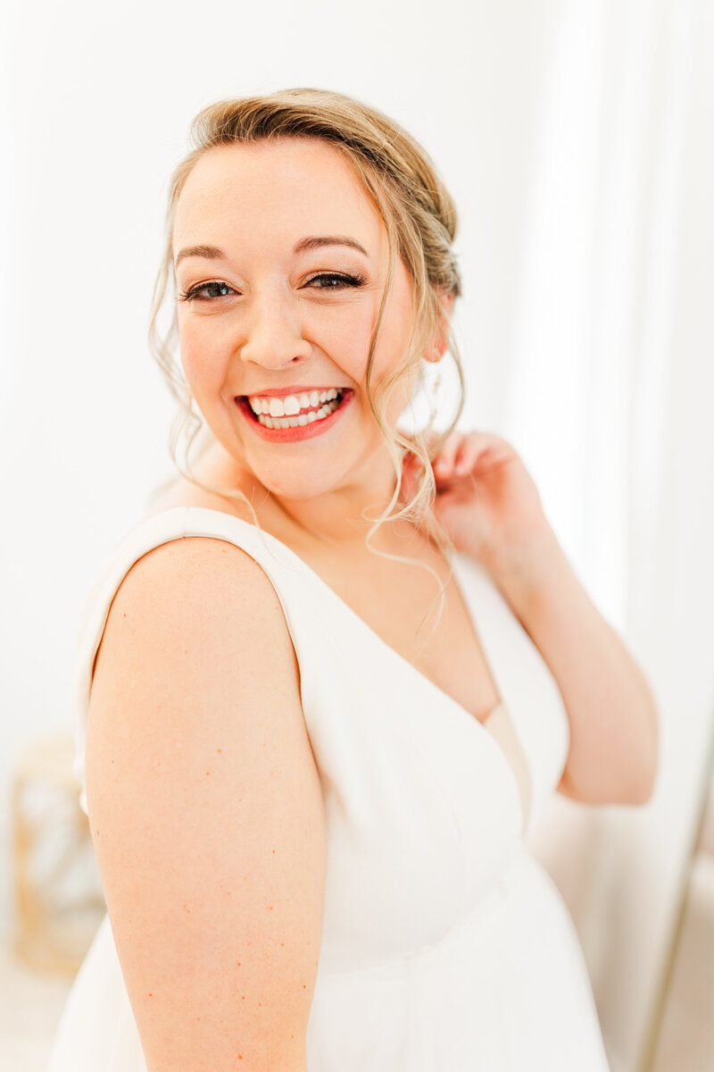 a bride smiling on her wedding day
