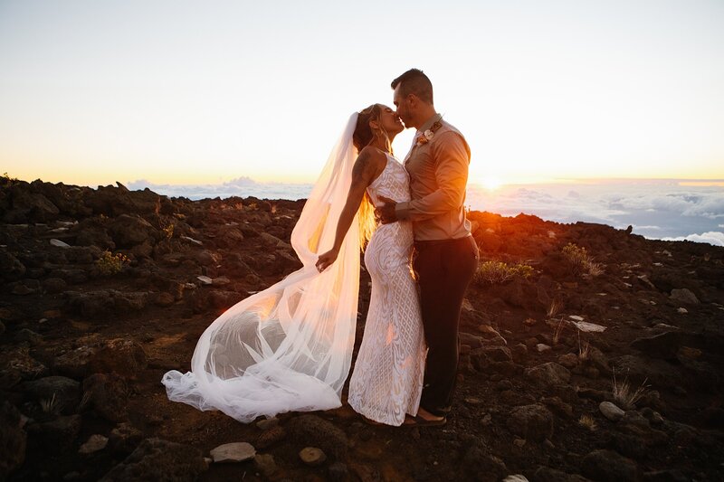 A bride and groom elope on Maui during sunset