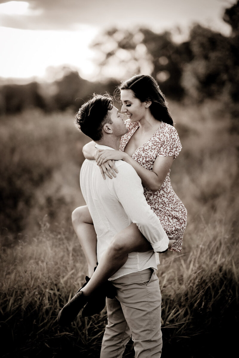 Man carries his girl for engagement photo