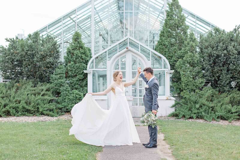 Grey Loft Studio - Bethany and Luc Barette - Wedding Photography Wedding Videography Ottawa - Couple Twirling in front of Ottawa Arboretum
