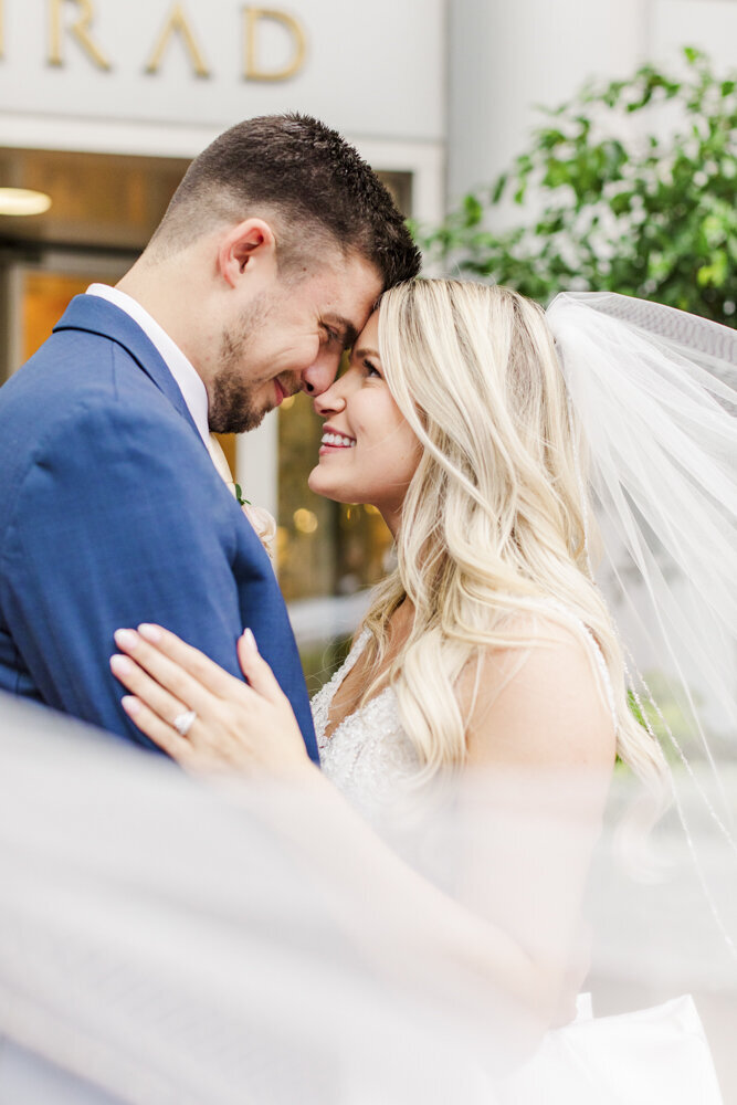 groom and bride touching foreheads