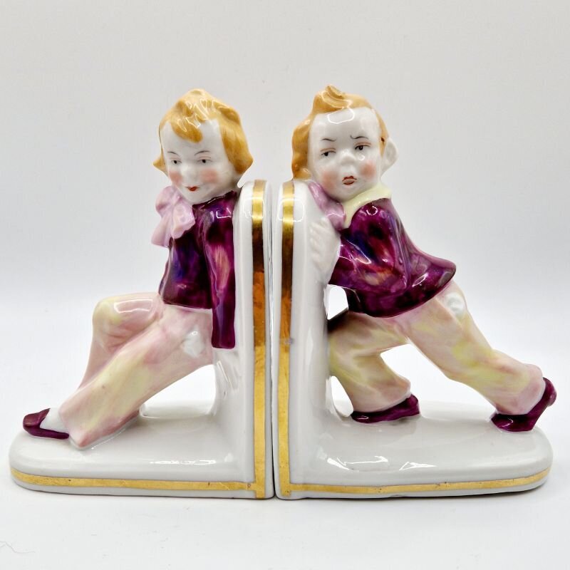 Porcelain vintage boy figurine bookends with gold trim, collectible home décor