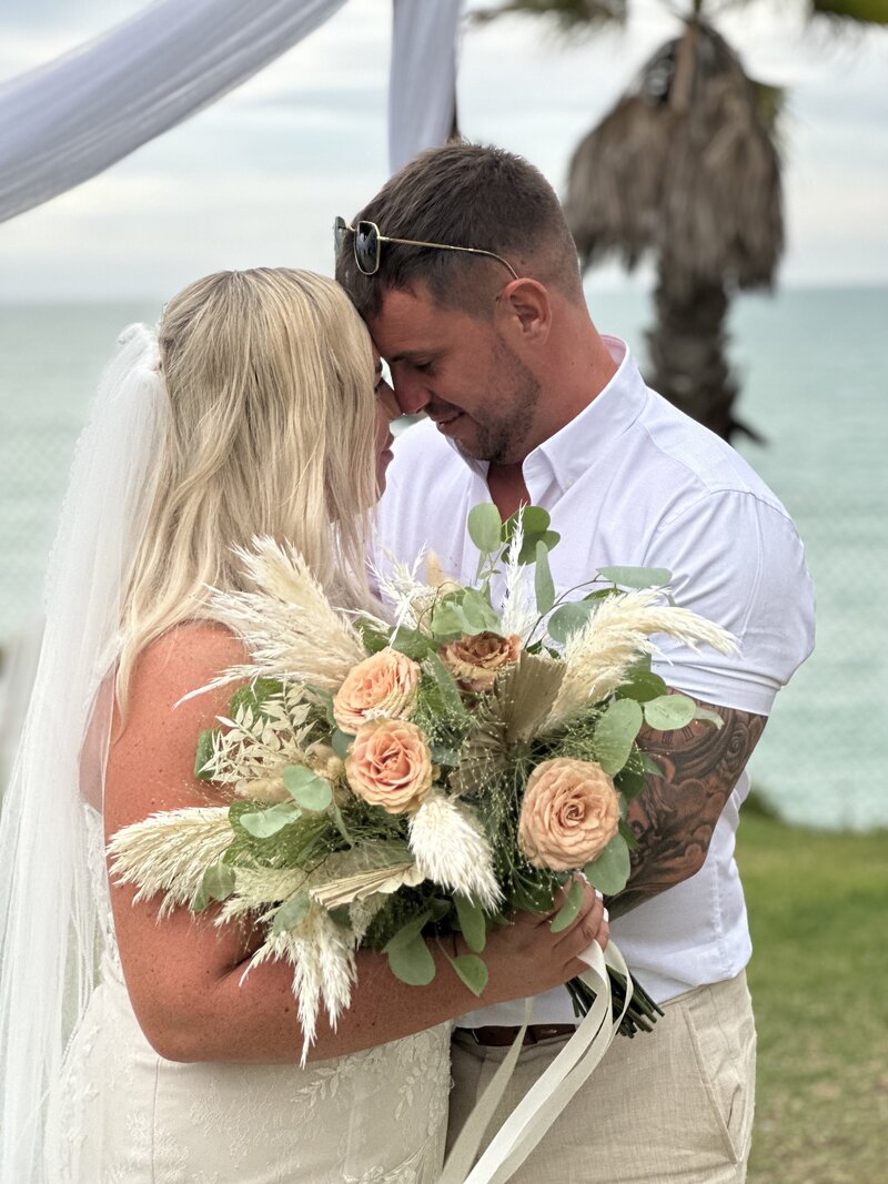 Bride and groom smiling at each other